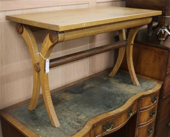 An Arts and Crafts style oak table W.90cm